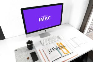 Free-iMac-on-Designer-Workspace-Mockup-2018