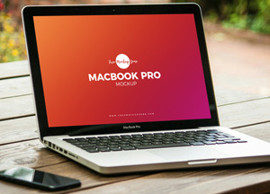 Free-MacBook-Pro-on-Wooden-Table-Mockup-PSD-600.jpg