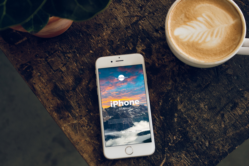 Free-iPhone-With-Coffee-Cup-Mockup