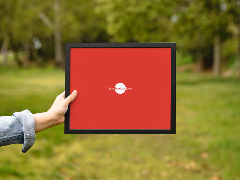 Free-Girl-Showing-Frame-Mockup-PSD-1