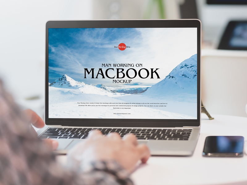 Free-Man-Working-on-MacBook-Mockup