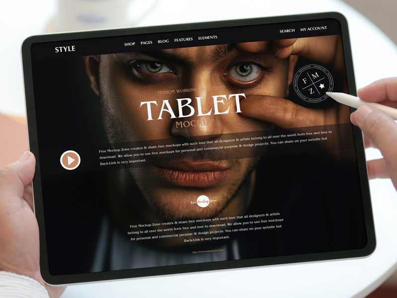 Free-Person-Working-on-Modern-Tablet-Mockup-600