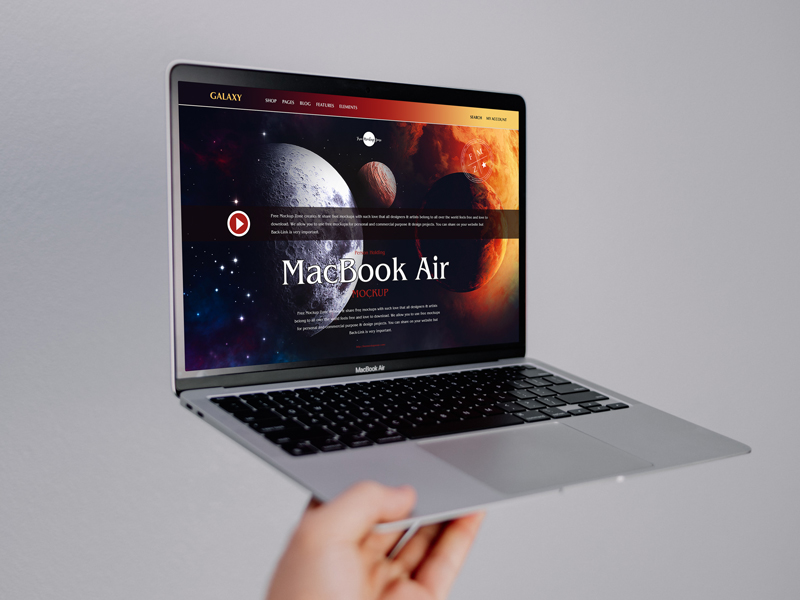 Free-Person-Holding-MacBook-Air-Mockup