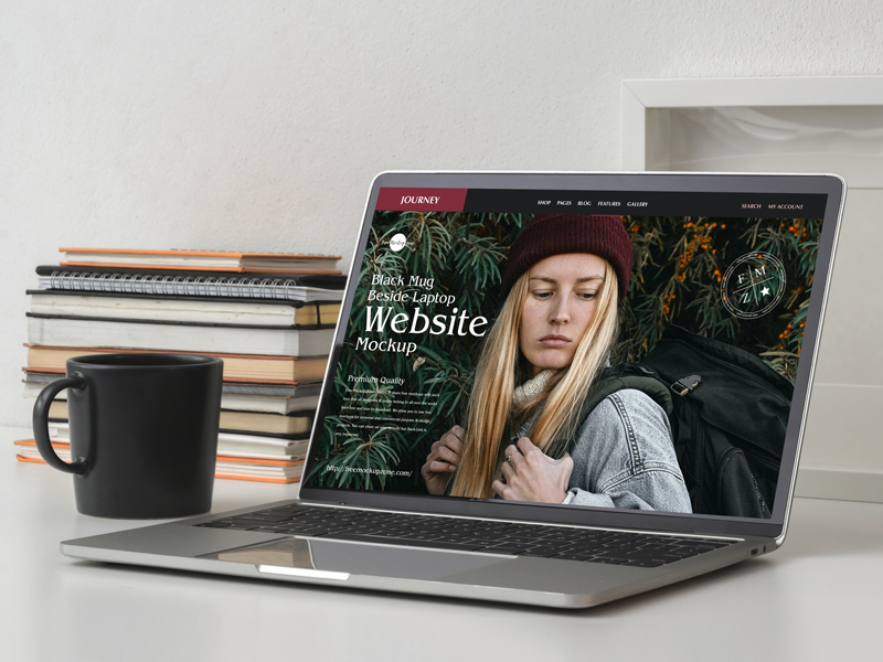 Free-Black-Mug-Beside-Laptop-Website-Mockup