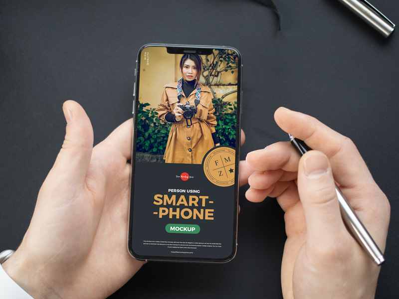 Free-High-Quality-Person-Using-Smartphone-Mockup-PSD-600