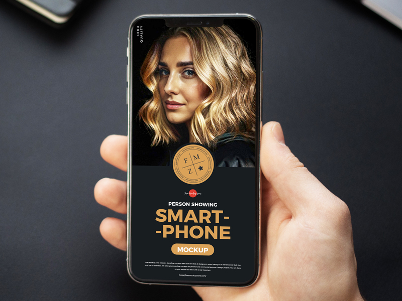 Free-High-Quality-Person-Showing-Smartphone-Mockup-600