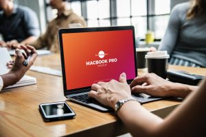 Free-Person-Using-MacBook-Pro-Mockup-PSD-2018