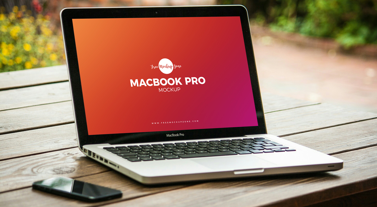 Free-MacBook-Pro-on-Wooden-Table-Mockup-PSD