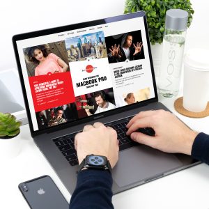 Free-Man-Working-on-MacBook-Pro-Mockup-PSD