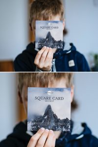 Free-Little-Boy-Showing-Square-Card-Mockup-PSD-600