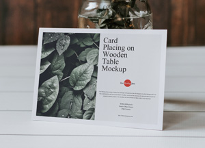 Free-Card-Placing-on-Wooden-Table-Mockup-300.jpg