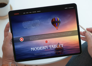 Free-Person-Using-Modern-Tablet-Mockup-300.jpg