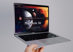 Free-Person-Holding-MacBook-Air-Mockup-300