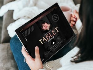 Free-Person-Holding-Tablet-Mockup-PSD