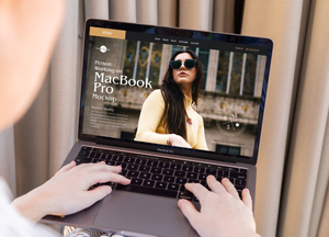 Free-Person-Working-on-MacBook-Pro-Mockup-PSD-300