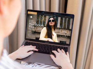 Free-Person-Working-on-MacBook-Pro-Mockup-PSD