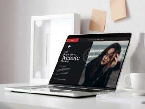 Free-High-Quality-Cup-Beside-Laptop-Website-Mockup